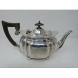 An Edwardian silver tea pot, hallmarked: CB&S or Cooper Brothers and Sons, Sheffield, 1907. Four