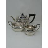Silver three piece matching tea set with tea pot, milk jug and sugar bowl, hallmarked: EV for