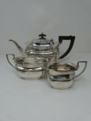 Silver three piece matching tea set with tea pot, milk jug and sugar bowl, hallmarked: EV for