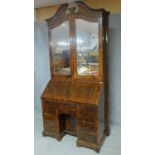 A 19th century Continental rosewood bureau bookcase with original bevelled mirrored glass upper