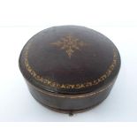 An antique round travel clock in leather gilded case by Edwards & Sons of Glasgow, 161 Regent