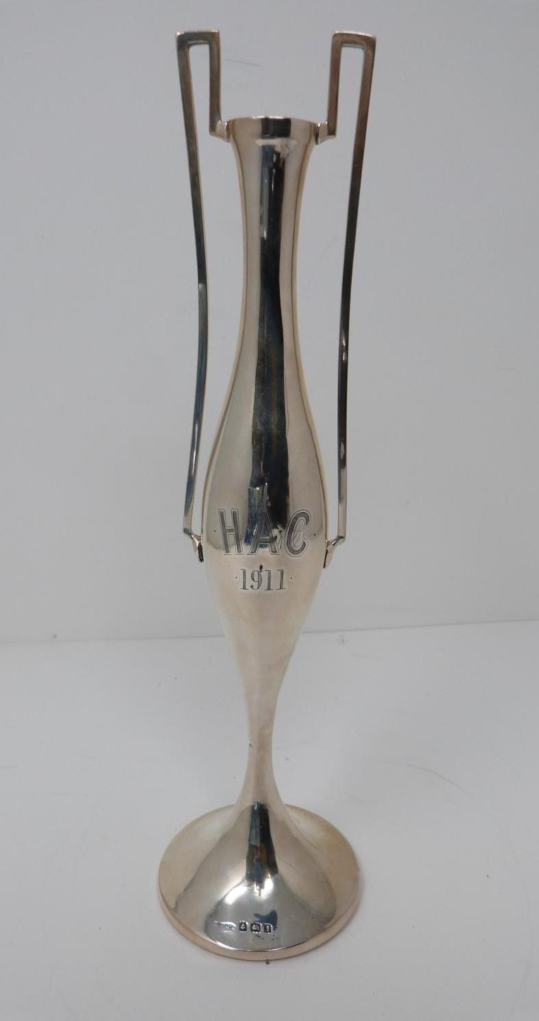 A two handled silver vase. Engraved H.A.C. 1911. Hallmarked: H J C & Co for Henry James Cooper &