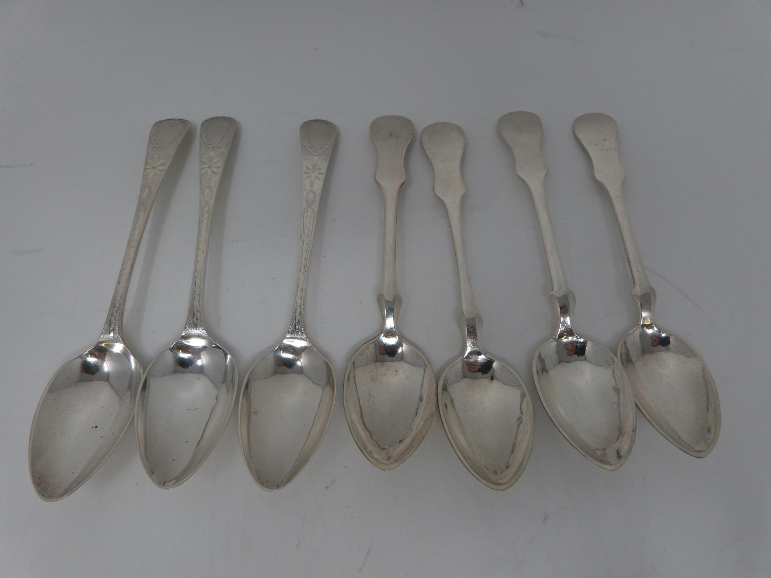 A collection of silver teaspoons including three engraved Georgian silver coffee spoons, hallmarked: