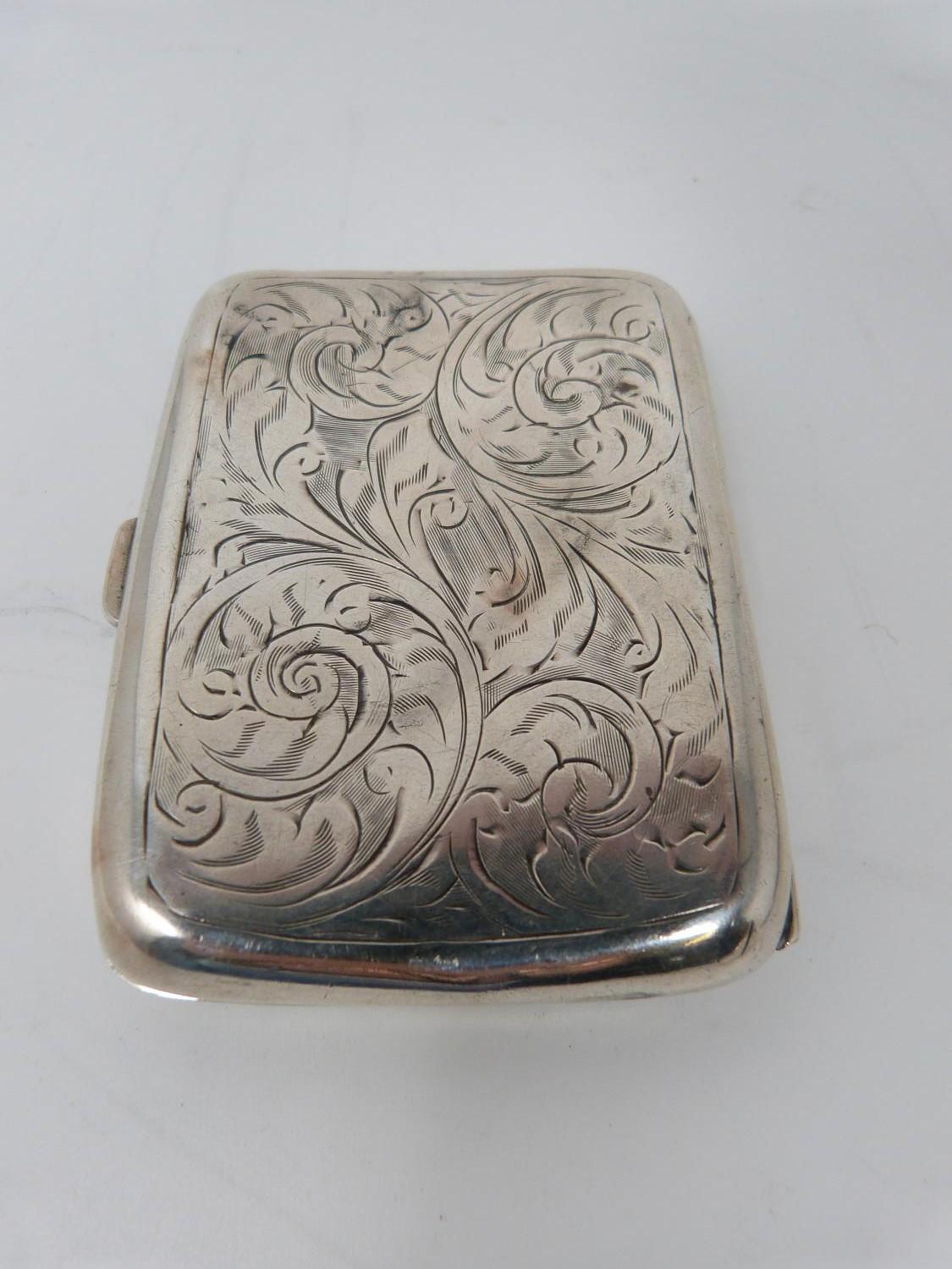 Two silver cigarette cases, the smaller with stylised foliate decoration and central shield - Image 9 of 12