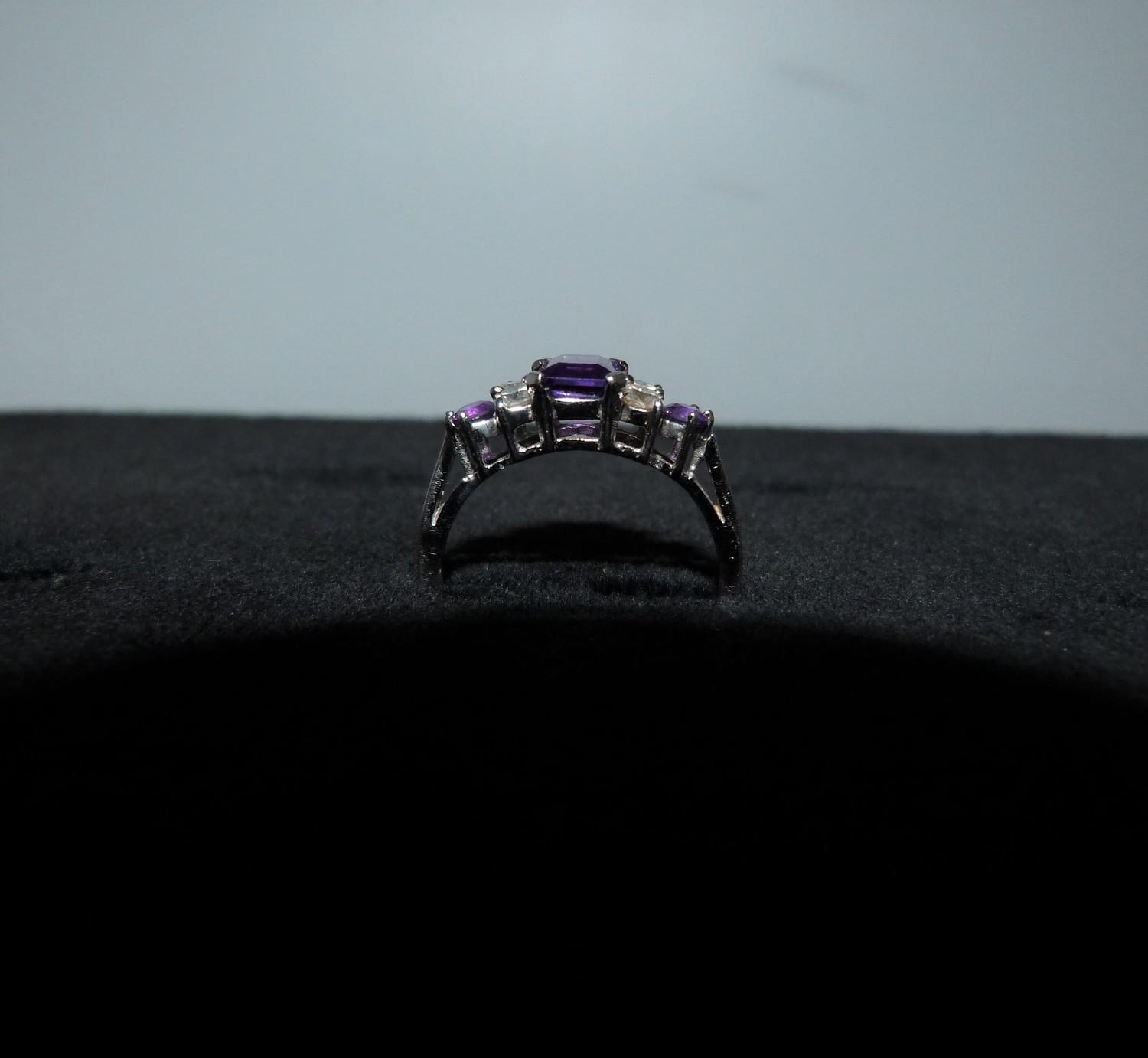 An Amethyst and diamond 18ct white gold ring, set to centre with a emerald cut amethyst in a four - Image 8 of 8