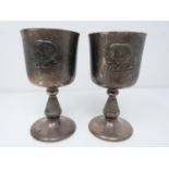 A pair of silver royal commemorative cups, engraved on the base 'Westminster Abbey + 14th November