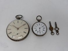 A pair of silver pocket watches, one French with white enamel dial and black roman numerals,