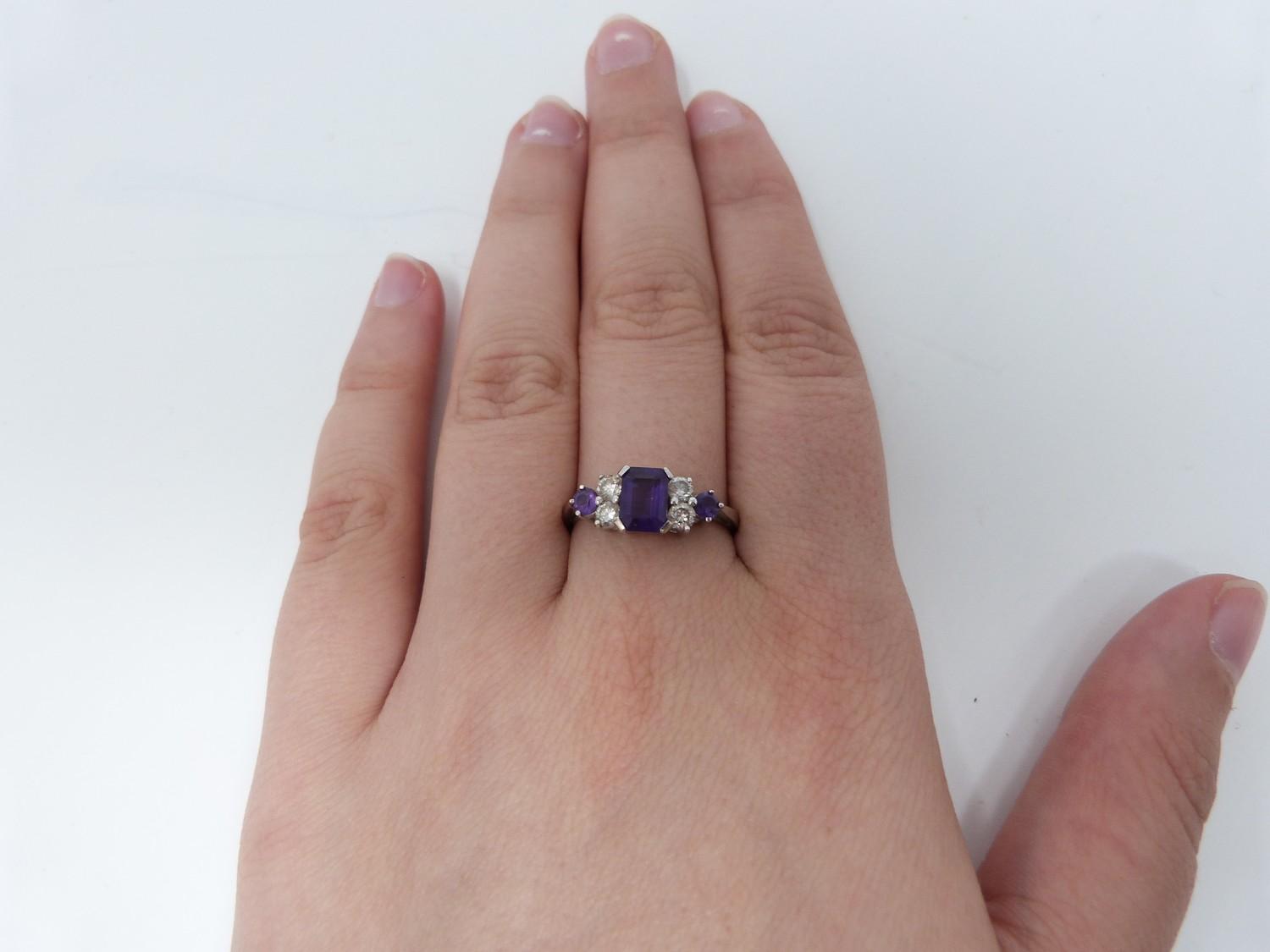 An Amethyst and diamond 18ct white gold ring, set to centre with a emerald cut amethyst in a four - Image 6 of 8