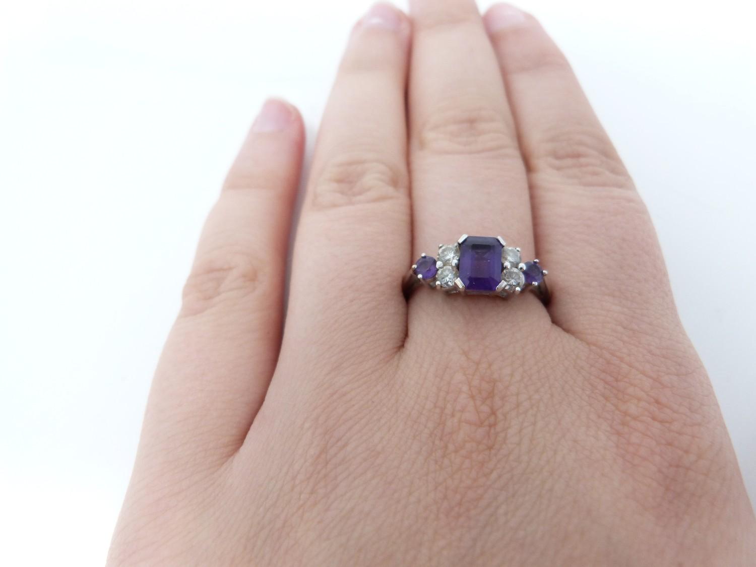 An Amethyst and diamond 18ct white gold ring, set to centre with a emerald cut amethyst in a four - Image 7 of 8