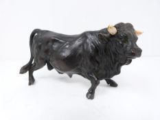 A bronze bull with bone horns, marked to bottom of left hooves 'R8271' and 'JB', realistically