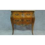 A Louis XV style kingwood marquetry floral and foliate inlaid commode with moulded marble top