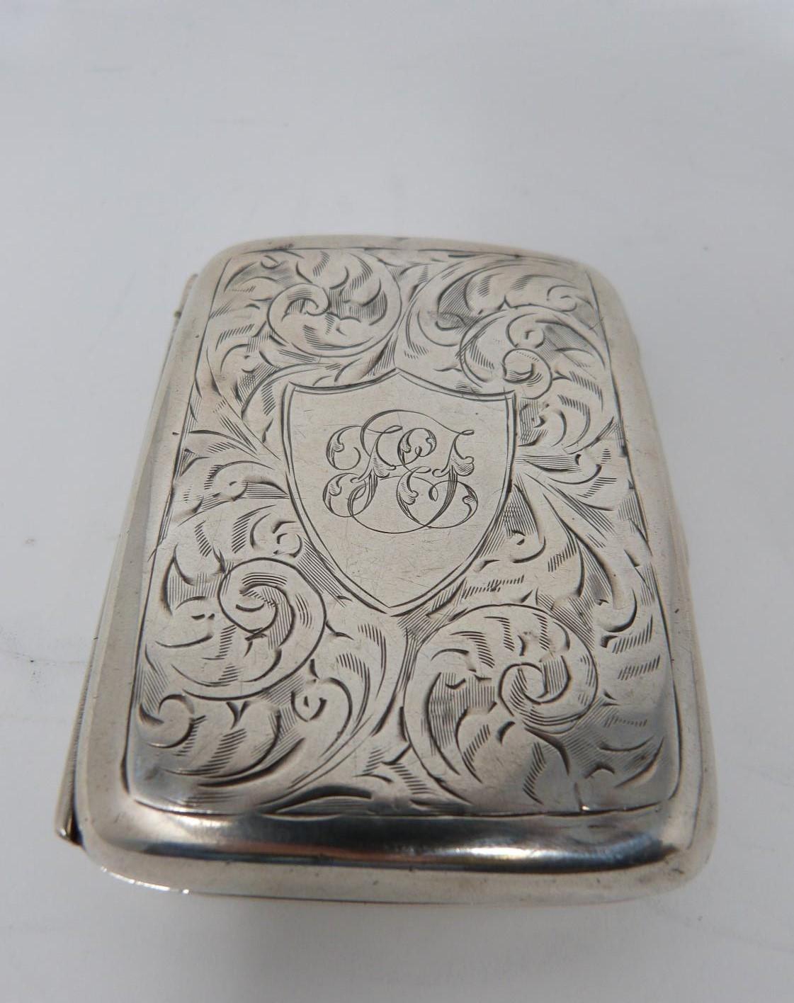 Two silver cigarette cases, the smaller with stylised foliate decoration and central shield - Image 8 of 12