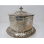 An engraved silver plated biscuit barrel on pierced stand, engraved with ribbon and stylized foliate
