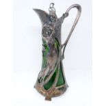 A 19th century WMF Warszawa Art Nouveau Silver plate claret jug, with bottle green liner, berries
