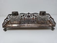 A silver and glass piercework desk inkwell, two bottles with silver tops and rope edging. Ink