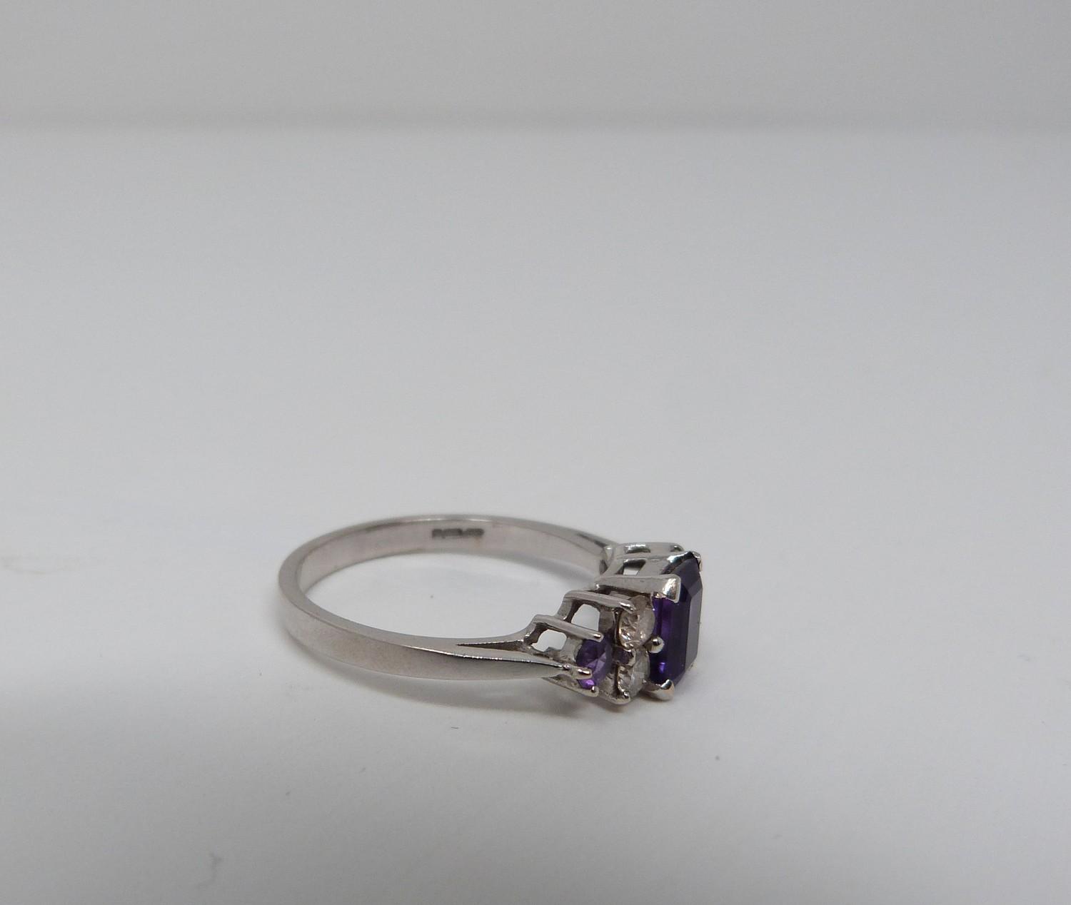 An Amethyst and diamond 18ct white gold ring, set to centre with a emerald cut amethyst in a four - Image 4 of 8