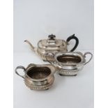 A three piece matching silver tea set, hallmarked: HEBFEB for Barker Brothers (Herbert Edward Barker