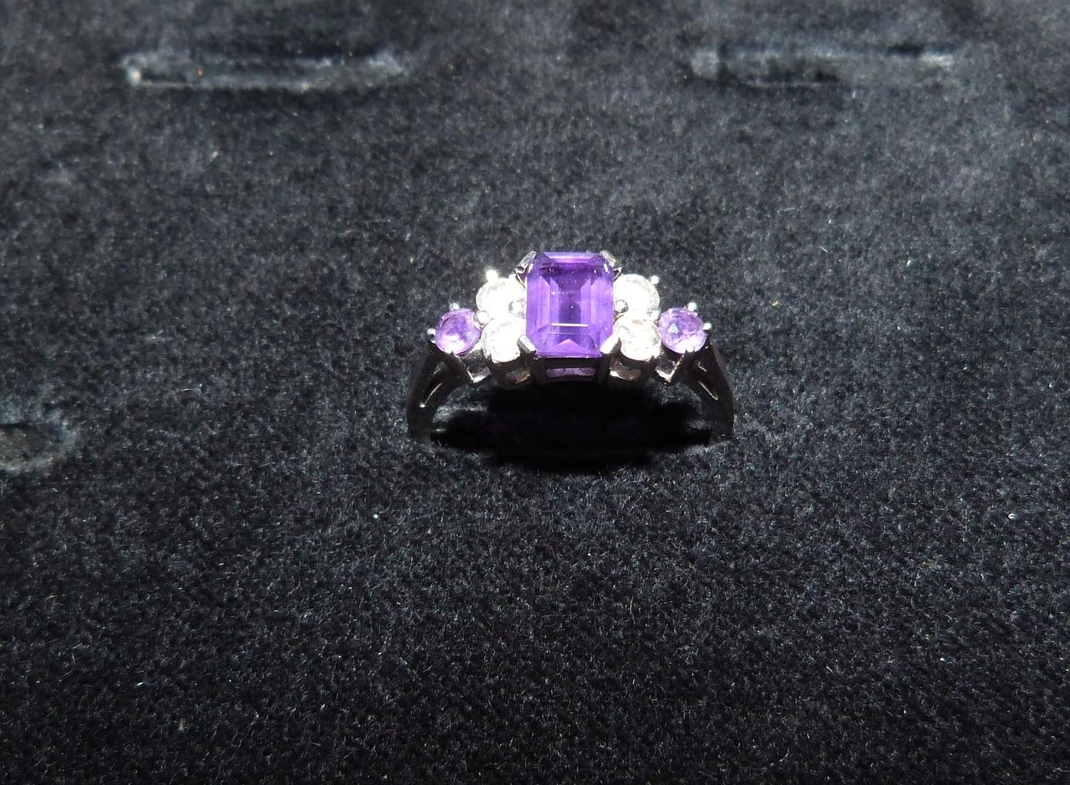 An Amethyst and diamond 18ct white gold ring, set to centre with a emerald cut amethyst in a four - Image 2 of 8