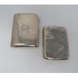 Two silver cigarette cases, the smaller with stylised foliate decoration and central shield