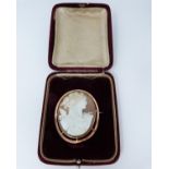 A 9ct Rose gold shell cameo of Dionysis side profile, makers mark AW, 9ct gold mark, he is