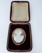 A 9ct Rose gold shell cameo of Dionysis side profile, makers mark AW, 9ct gold mark, he is