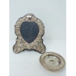 A silver heart photo frame and dish, photo frame with repousse silver design with cherubs and