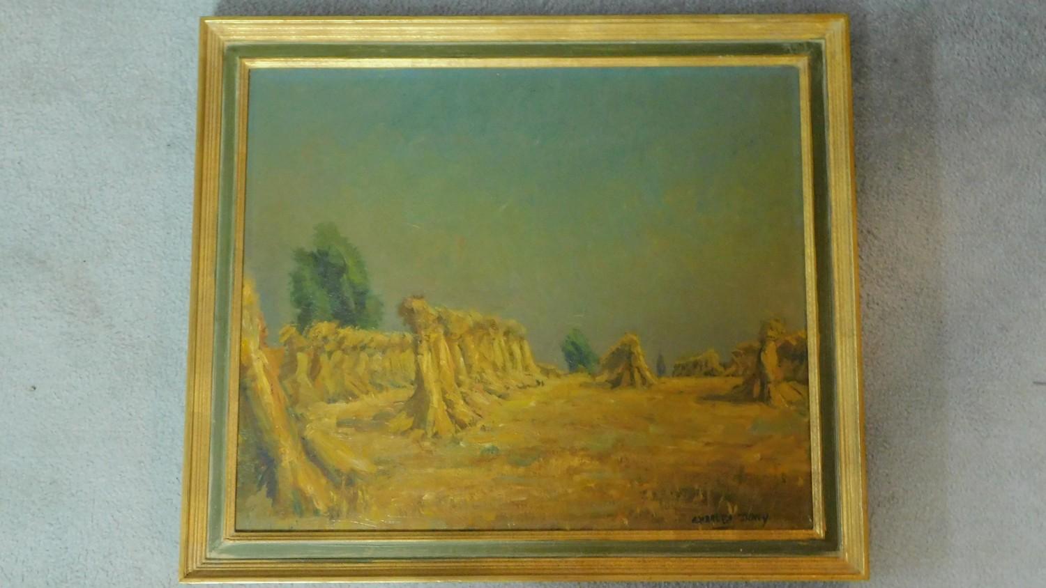 A gilt framed oil on canvas, impressionist style harvest scene, signed Charles Dony. 60x70cm