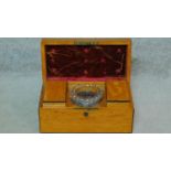 A 19th century satinwood with ebony lining tea caddy with two fitted lidded compartments and