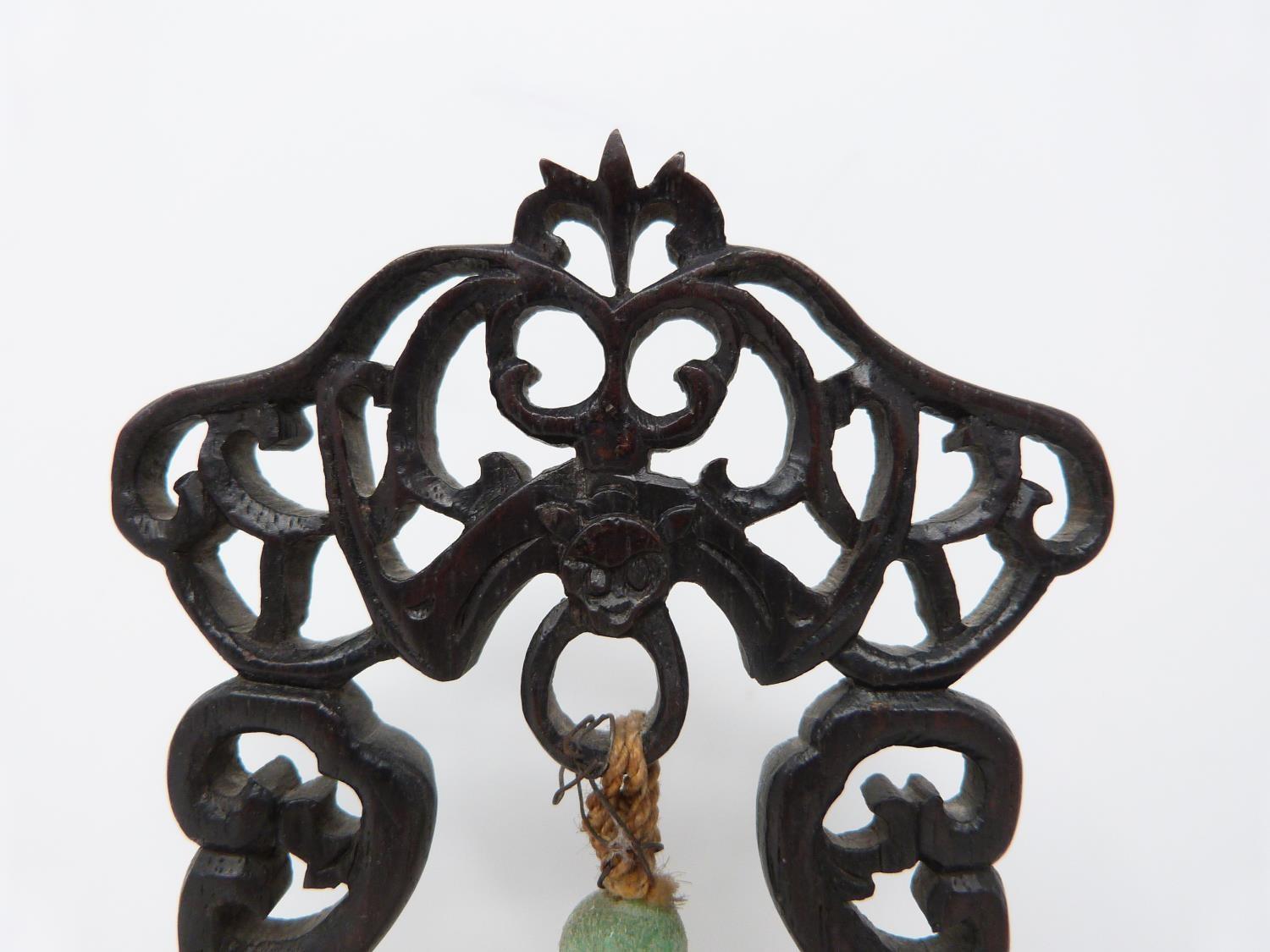An early 20th century jade pendant on carved wooden stand. Pale celadon jade pendant in the form - Image 4 of 6