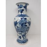 A Kangxi style blue and white baluster dragon vase with floral motifs. Four character mark to