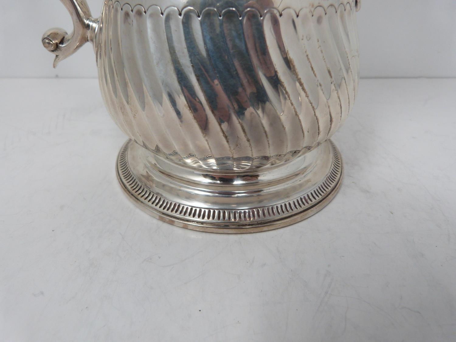 A Victorian sterling sliver coffee pot, with armorial crest on front, ebony handle and scrolling - Image 3 of 7