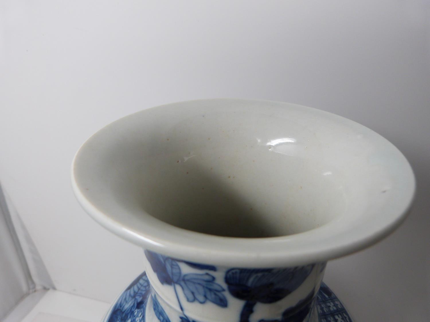 A Kangxi style blue and white baluster dragon vase with floral motifs. Four character mark to - Image 5 of 5