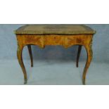 A 19th century burr walnut and kingwood crossbanded writing table with ormolu mounts and allover