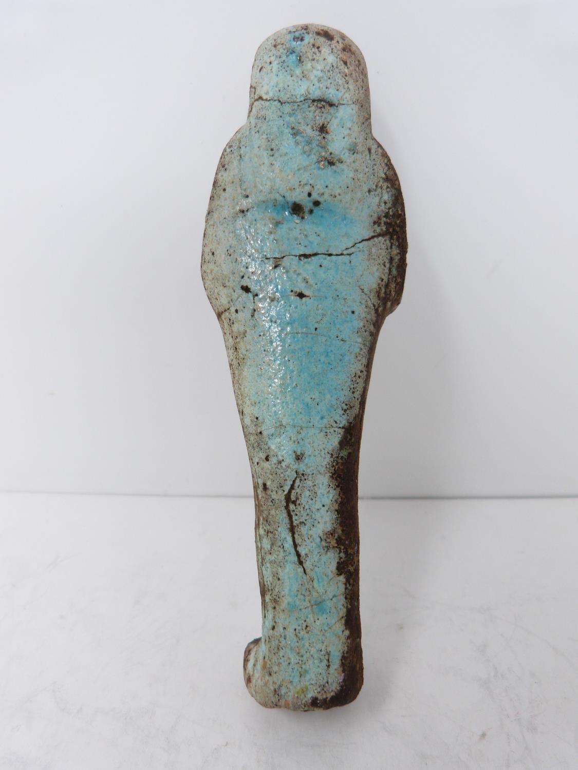 An antique replica of an Egyptian Shabti, pale blue glaze and hieroglyphs to front. Height 4.5cm. - Image 2 of 5