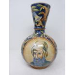 An Italian majolica vase with male and female painted portraits. Two circular panel with an