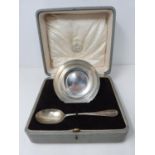 A sterling silver cased set of bowl and spoon. Engraved F.P.C., 1925. Bowl hallmarked WH &S Ltd