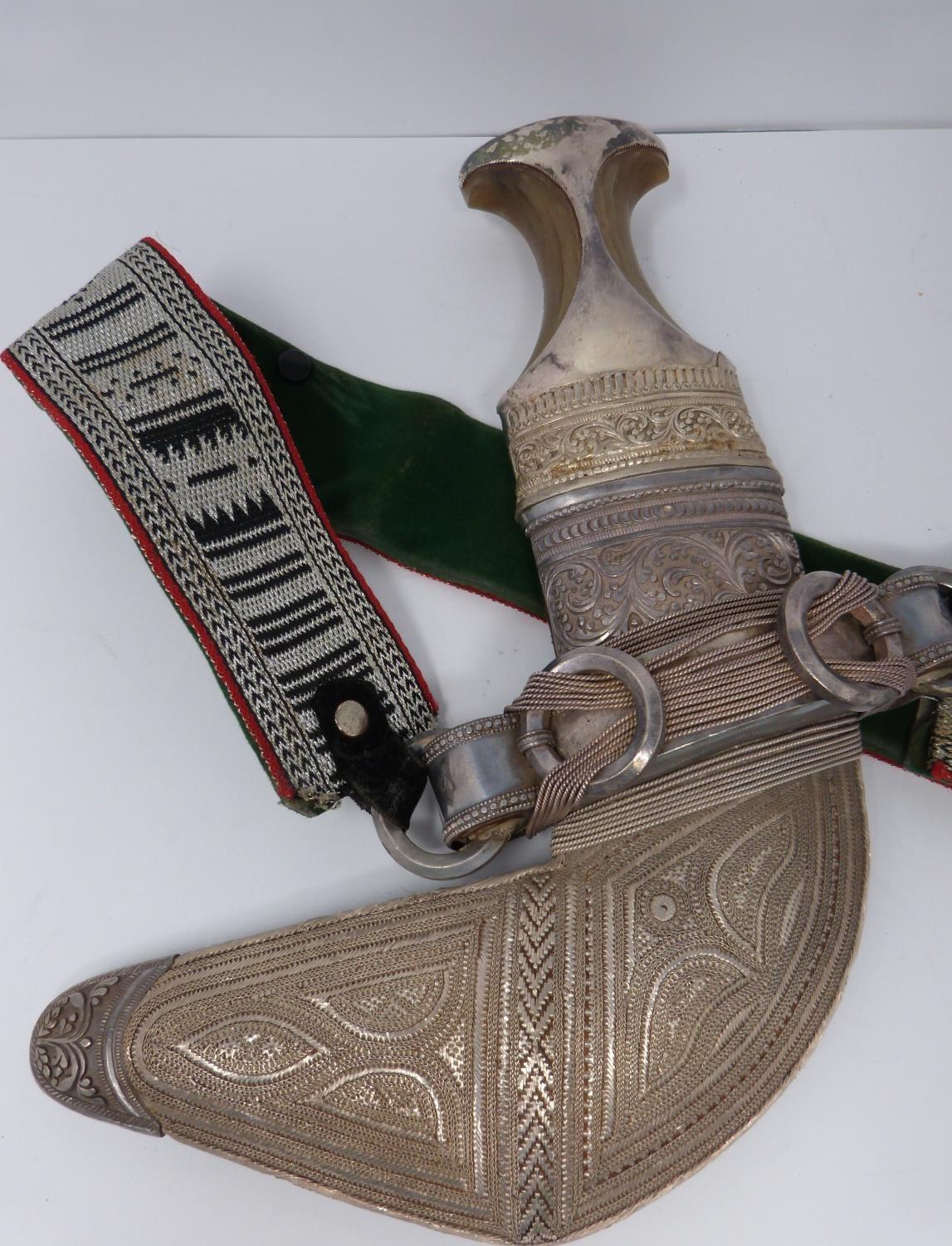 A 20th century silver Omani Khanjar with colourful and silver thread woven strap, covered with - Image 2 of 12