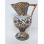 An antique Italian majolica lustre jug. Decorated with stylised floral and foliate design. With an