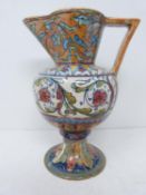 An antique Italian majolica lustre jug. Decorated with stylised floral and foliate design. With an