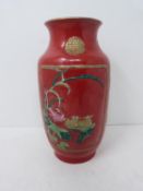 A Chinese polychrome glazed baluster vase with relief lotus and Chinese ducks decoration and gilt