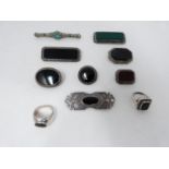 A collection of gemset brooches and rings, including a silver Art Deco brooch set with synthetic