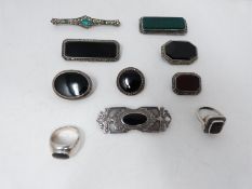 A collection of gemset brooches and rings, including a silver Art Deco brooch set with synthetic