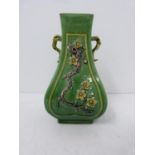 A Kangxi style green-glazed square-section vase with relief prunus decoration. Height 13.7cm.