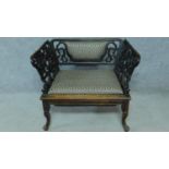 A 19th century carved and pierced Chinese hardwood chair featuring dragon and floral motifs with