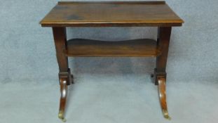 A late Georgian mahogany architect's table with rising, adjustable sloped top, fitted pair of candle