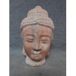 An antique Chinese pink hardstone carved buddah's head. Height 46cm.