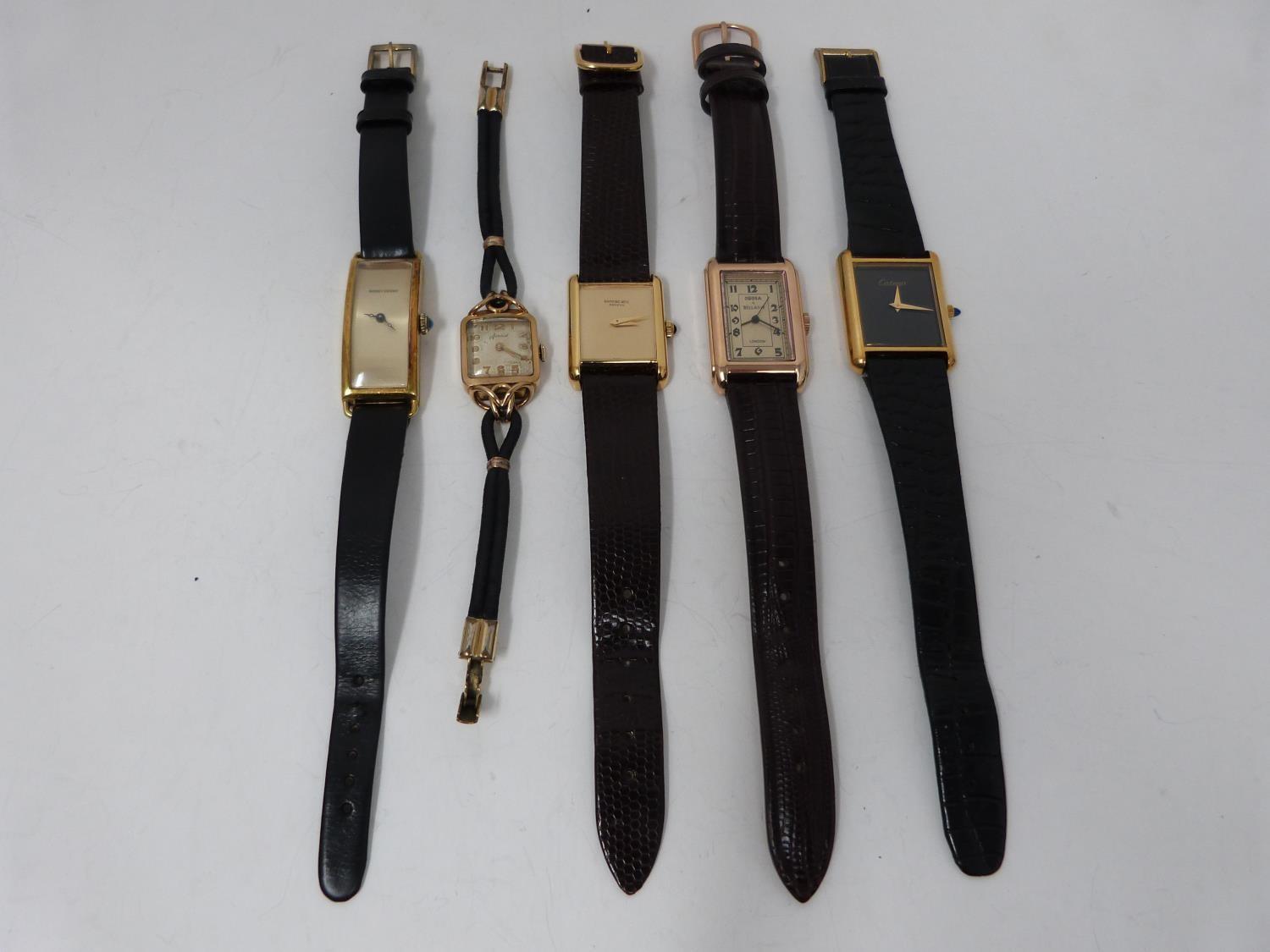 A collection of five gold plated mens and ladies vintage watches. Cantina 18k plated mens watch on a