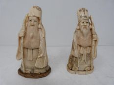 A pair of antique Japanese ivory figures. One of Fukorokujo , one of the seven gods of Fortune. He