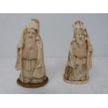 A pair of antique Japanese ivory figures. One of Fukorokujo , one of the seven gods of Fortune. He