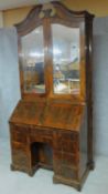 A 19th century Continental rosewood bureau bookcase with original bevelled mirrored glass upper